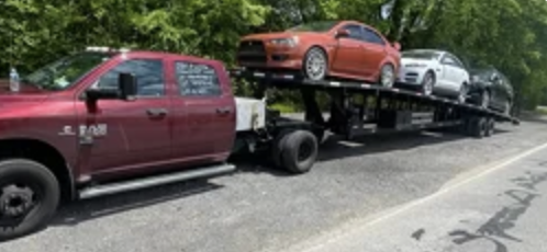 RAM 3500 com trailer de 3 carros carregado